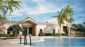 A modern hotel with a swimming pool, palm trees, and a clear sky. - 2946 BY - Wellness Ridge Sanctuary (Clermont)