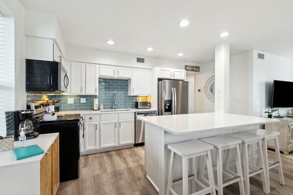 Fridge, microwave, oven, stovetop - Updated 6-bedroom, 4 bath well stocked coastal cottage across from the beach with a private pool (Fernandina Beach)