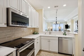 Fridge, microwave, oven, stovetop - Oceanfront Penthouse Retreat – 7th Floor at Ocean Place (Fernandina Beach)