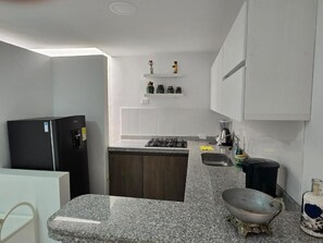 Apartment, Balcony, Mountain View | Private kitchen | Fridge, microwave, cookware/dishes/utensils