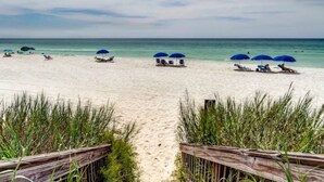 A beach with wooden pathways, beach umbrellas, and lounge chairs. - Gulf Front w/ Amazing Panoramic Gulf Views! Seacrest Beach | Private Beach Access (Seacrest Beach)