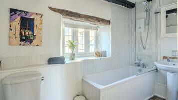 Shower, hair dryer, towels, shampoo