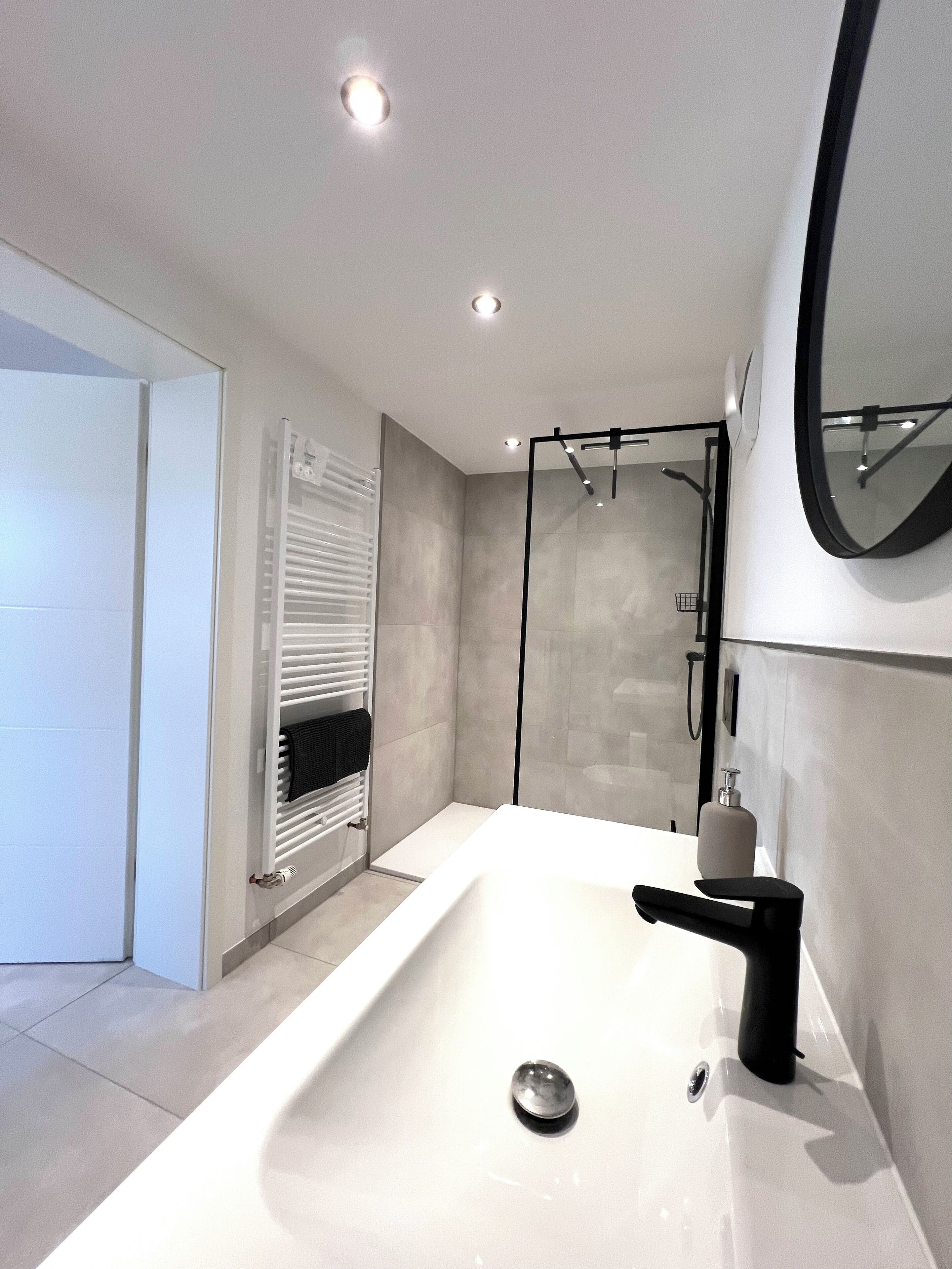Shower, hair dryer, towels, toilet paper