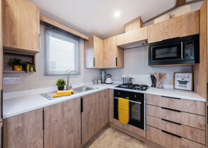 Private kitchen - Modern, spacious holiday caravan with two bedrooms sleeping four people. (Golspie)