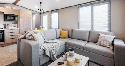 Modern, spacious holiday caravan with two bedrooms sleeping four people.