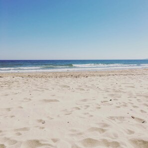 A beach with sand and waves. - Bournemouth Beach Boutique with Hot Tub (Sleeps 14 and 5 mins walk to Beach) (Bournemouth)