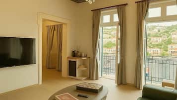 Deluxe Apartment, Balcony, Sea View | Living area