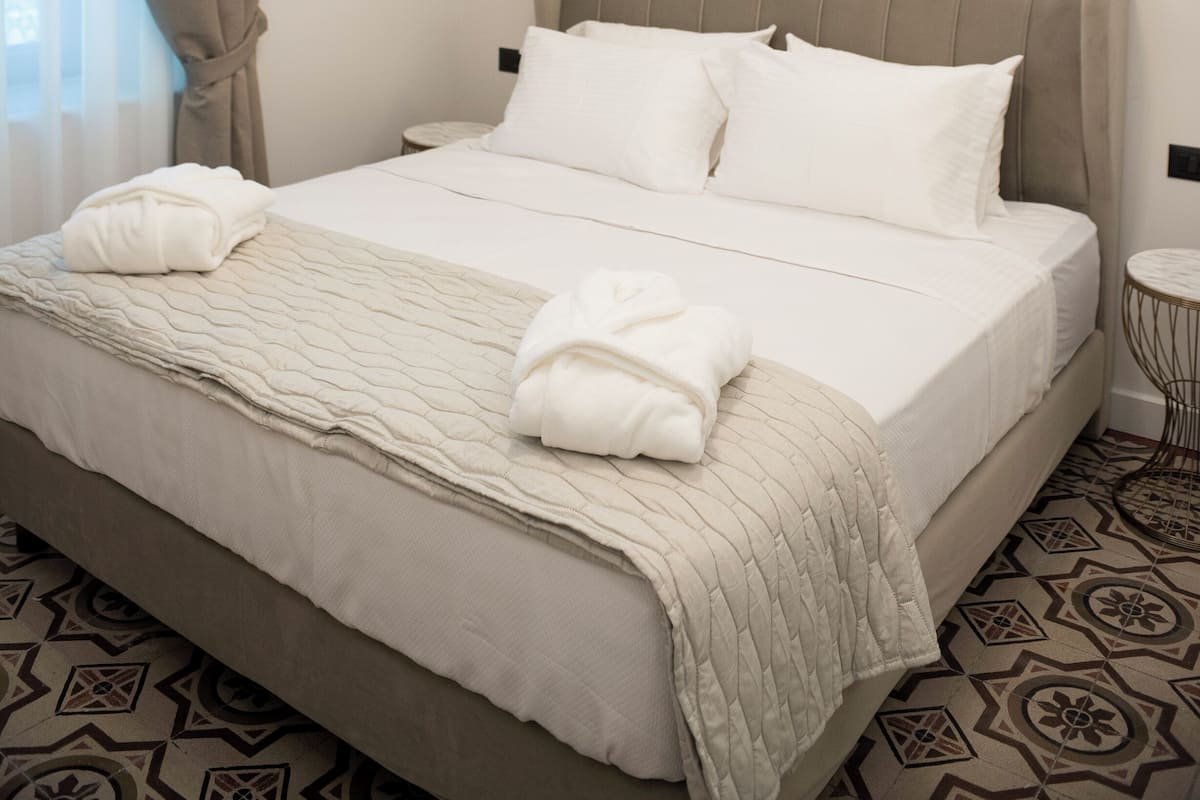 Suite superior, patio, vista a la ciudad