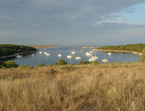 A coastal landscape with a marina filled with sailboats. - Relaxing Getaway Near Adriatic Sea (Marcana)