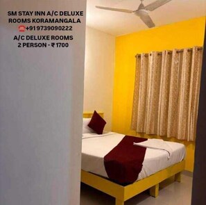 Chambre Double Deluxe, vue ville | Coffres-forts dans les chambres, bureau