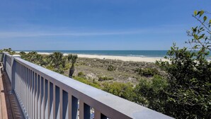A balcony with a view of a beach and ocean. - 15 Dune Lane: Oceanfront Views Await, New Pool & Additions Coming Spring '27! (Hilton Head Island)