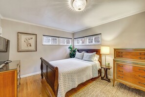 A bedroom with a bed, dresser, nightstand, and framed artwork on the wall. - Family Friendly! Turtle Creek Escape w/ Ping-pong (Turtle Creek)