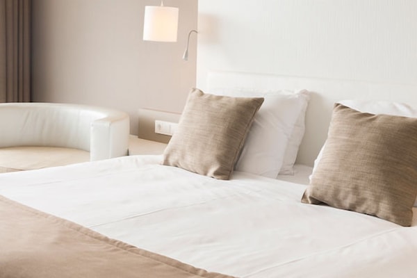 Sink into plush pillows and drift off in serene comfort.