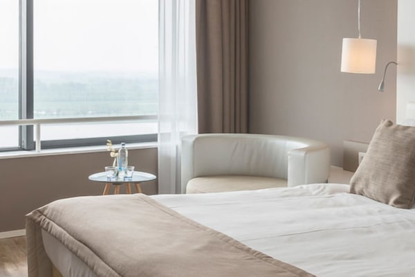 Linger by the window with coffee and calming horizon views.