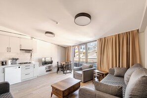 Àtic, balcó, vistes a la ciutat | Sala d'estar