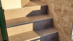A set of outdoor stone steps leading up to a building entrance. - Cozy Apartment in Vera, Just Steps From the Beach (Vera)