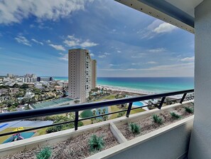 A high-rise building with a view of the beach and ocean. - Edgewater #1302 | Gulf Front + Amenities (Miramar Beach)