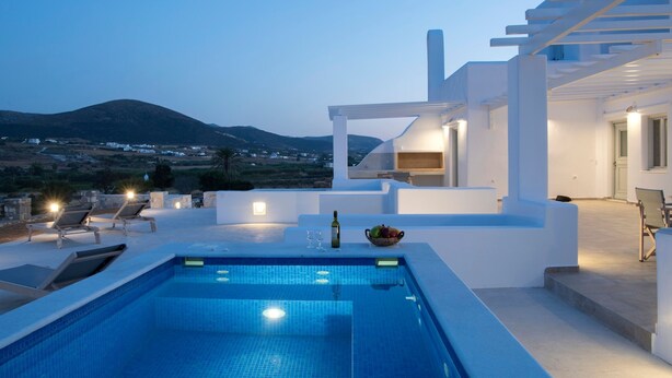A modern outdoor pool area with a clear view of the landscape and mountains in the background. - Happy  2-Bedroom sea view House, pool/jacuzzi! (Livadia)