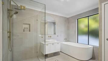Shower, towels, soap, toilet paper