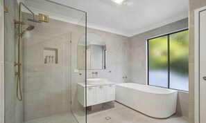 Shower, towels, soap, toilet paper