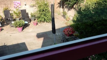 Familiekamer, uitzicht op tuin | Terras