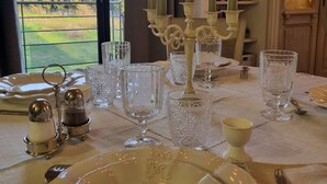 A dining table set with glassware, candles, and salt and pepper shakers. - Mas des Trois V - View Vignes & Ventoux - Gîte de Charme Premium 2 to 4 Adults (Sarrians)
