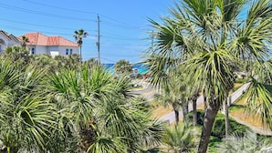 A residential area with palm trees, a house with a red roof, and a clear blue sky. - ☀️Private Beach Access | Pool+Hot Tub | Walk to Beach | Alerio D301⛱️ (Miramar Beach)