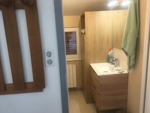 Shower, hair dryer, towels, toilet paper