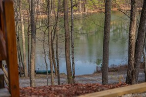 A forested area with a body of water, trees, and a dock. - Pretty Pond | Quiet | Sleeps 4 (Morganton)