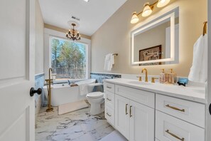 Shower, towels, soap, toilet paper