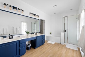 Shower, hair dryer, towels, shampoo