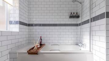 Shower, hair dryer, towels, shampoo