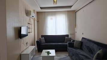 Comfort-lejlighed - udsigt til have | Opholdsområde