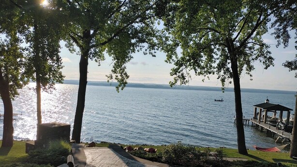 A lakeside patio with stone benches and a gazebo. - Cayuga Belle: Gorgeous Cayuga Lake Estate! Fabulous Views! (Seneca Falls)