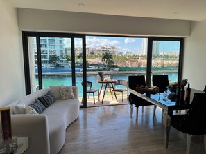 Signature Condo, Sea View | Living area - MARINA CONDO CORAZON (Cancún)
