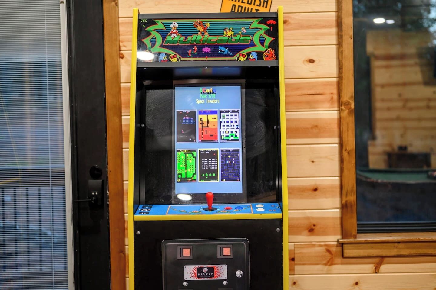 A vintage arcade machine with a colorful display and a joystick.