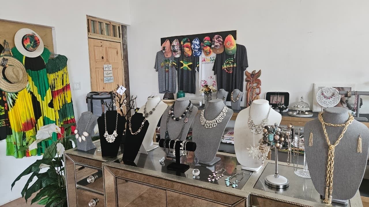 A jewelry display with various necklaces and earrings on mannequins.