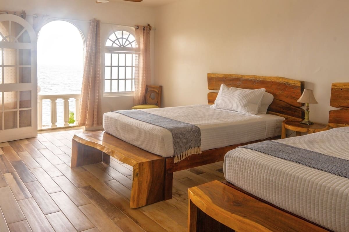Luxury Room, 2 Queen Beds, Ocean View | In-room safe, desk, laptop workspace, blackout drapes
