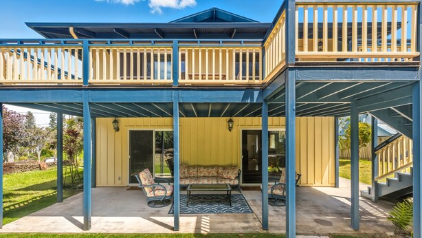 A two-story house with a balcony, a covered patio, and a front door. - 2 for 1 Stay: Jacuzzi/Starlit Mtn Skies/Near Beach (Waimea)
