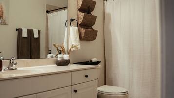 Shower, hair dryer, towels, soap