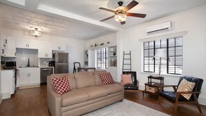 A modern kitchen with white cabinets, a built-in oven, and a ceiling fan. - Prime football location- condo walking distance from stadium (Knoxville)