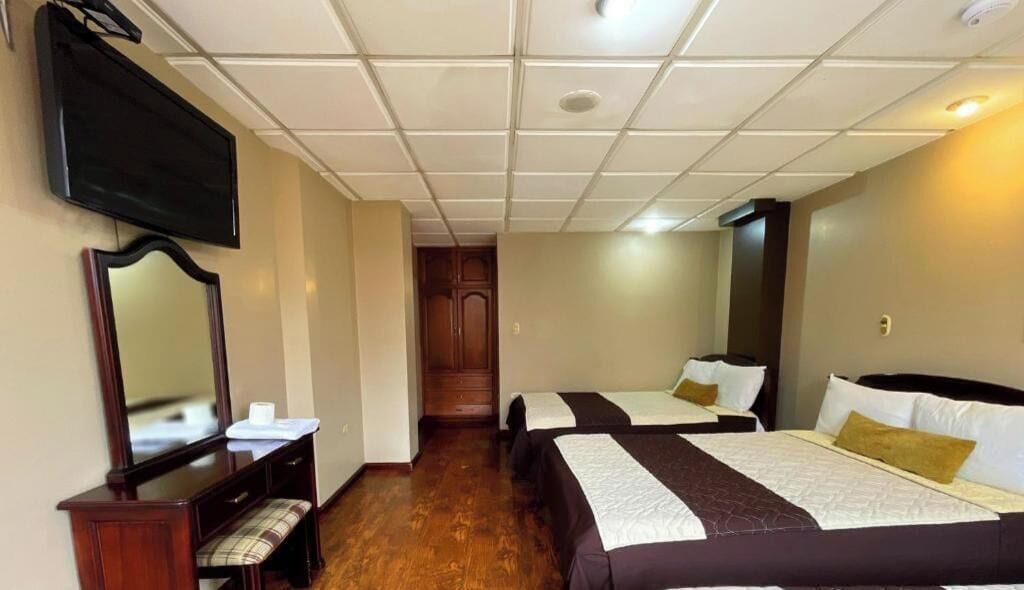 Family Room, Multiple Beds, Private Bathroom, City View | Iron/ironing board, free WiFi