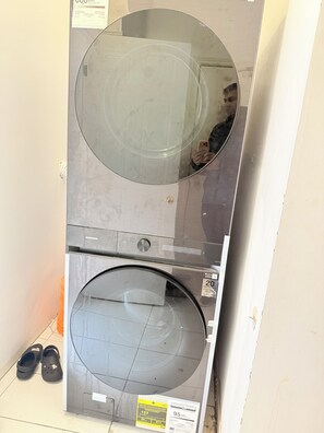 A stacked washer and dryer unit with a price tag of $13. - Two Bedrooms Basement Apartment - Heartland Area (Mississauga)