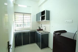 Apartment, 2 Bedrooms, Air conditioning | Private kitchen - Greens Apartments (Kozhikode)