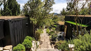 Deluxe Bungalow, Patio, Garden View | Property grounds