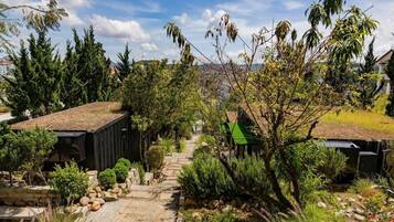 Deluxe Bungalow, Patio, Garden View | Property grounds