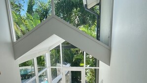 A staircase leading to a pool area with a view of the outdoors. - Tranquility on Buderim - large, light family home with expansive views. (Buderim)