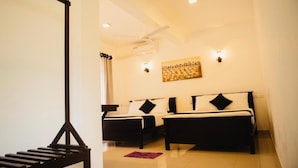A hotel room with two beds, a ceiling fan, recessed lighting, and a wall-mounted artwork. - 49 Ella (Ella)