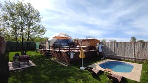 A backyard with a swimming pool, a barbecue area, and a covered outdoor seating area. - new dome house (Sapanca)
