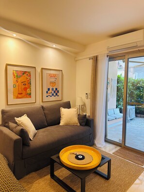 Living area - New Studio, large quiet Patio, Central, 5mi Beach (Cannes)